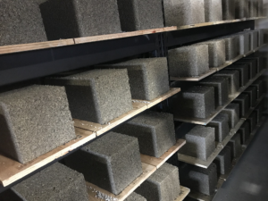 Hempcrete blocks on curing racks