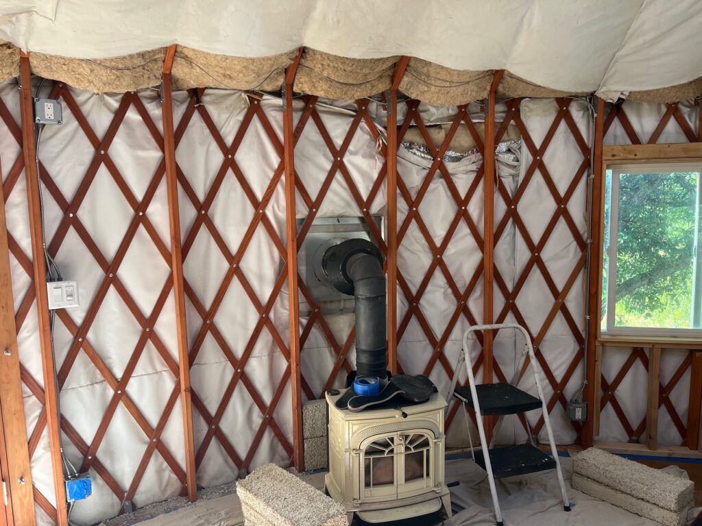 Yurt walls exposed before installation of hempcrete blocks for deep energy retrofit.